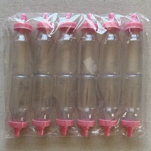 Set of 12 Pink Baby Bottle Party Favors.